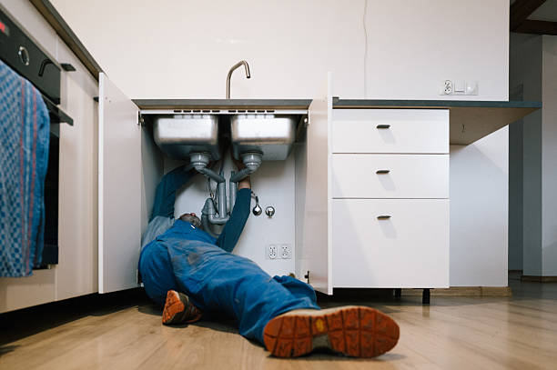 Professional Emergency Plumber technician working in Madison, MD